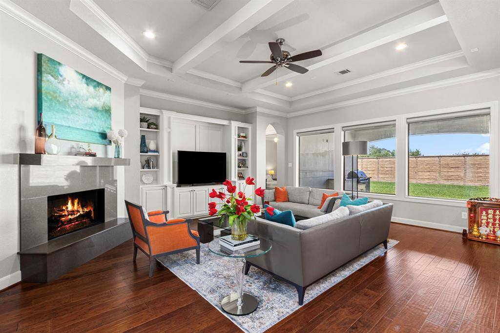Large living room featuring fire place and picture windows