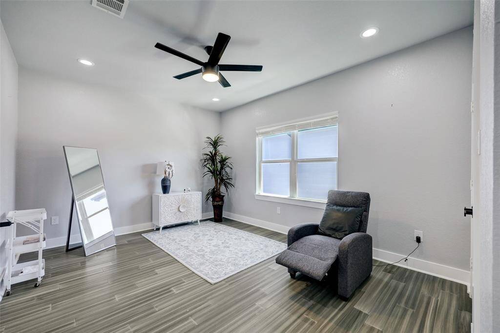 Secondary bedroom upstairs. Photos are staged. Property comes unfurnished.