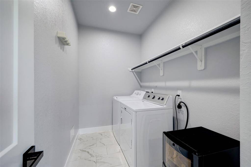 Laundry room with washer/dryer included.