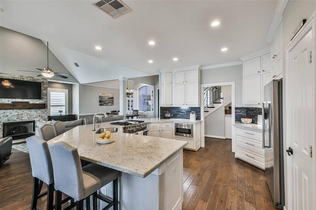 Chef's Kitchen with beautiful Countertops , Modern stainless Steel Appliances , Soft Close Drawers and Kitchen Cabinets. Large windows for natural Light.