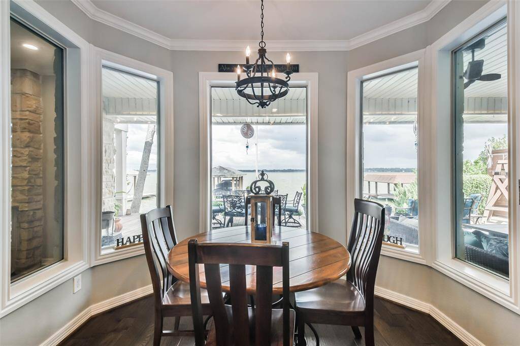 The expansive glass windows and doors allow natural light to flood the home throughout the day, enhancing its bright and airy ambiance..