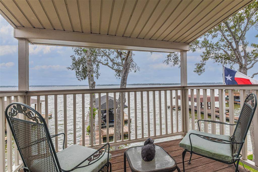 Breathlessly appealing living with impressive view from second floor balcony. From here you can appreciate the quality of selections by seller and the truly beautiful features of this Home.