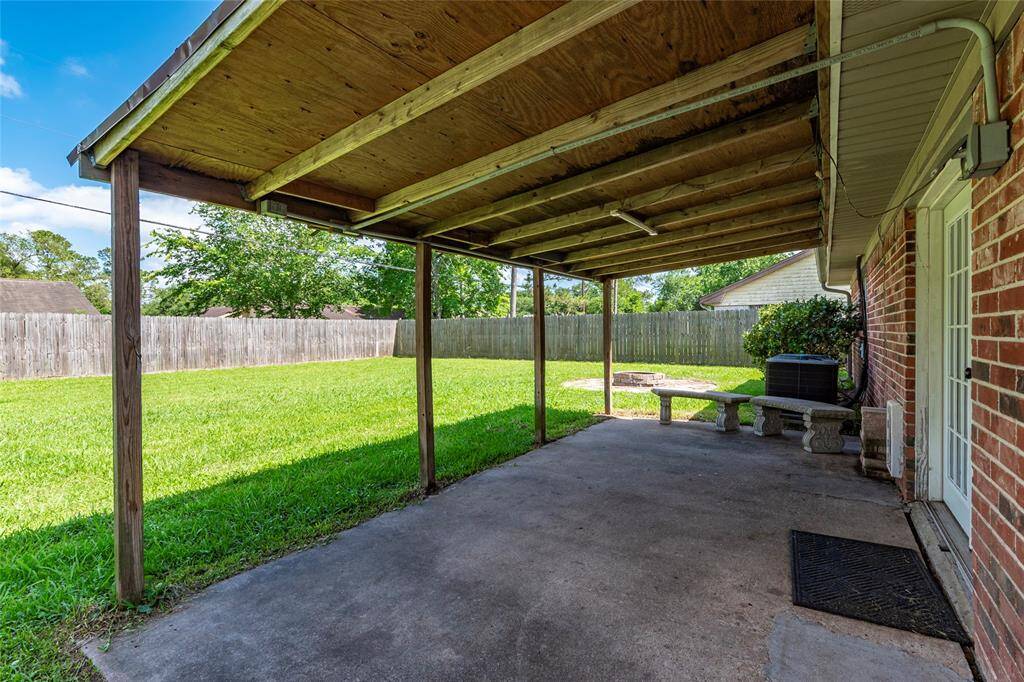 Covered back patio to spend those lovely evenings in.
