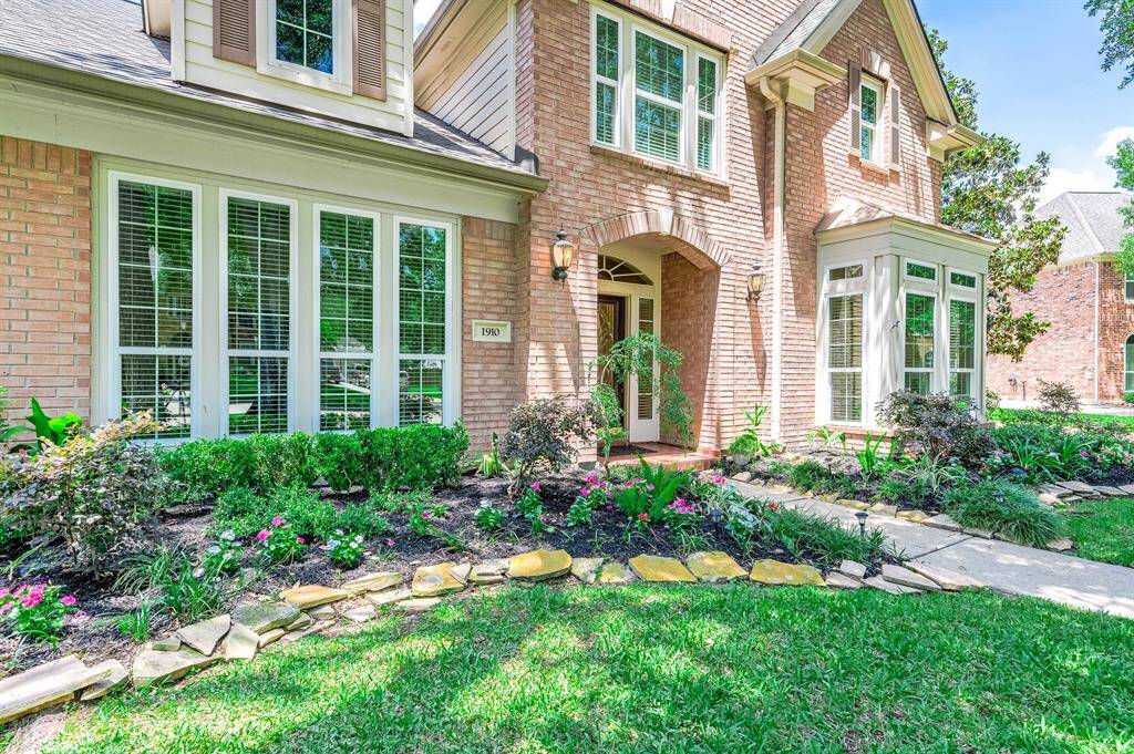 Stunning landscaping enhances the home's curb appeal.