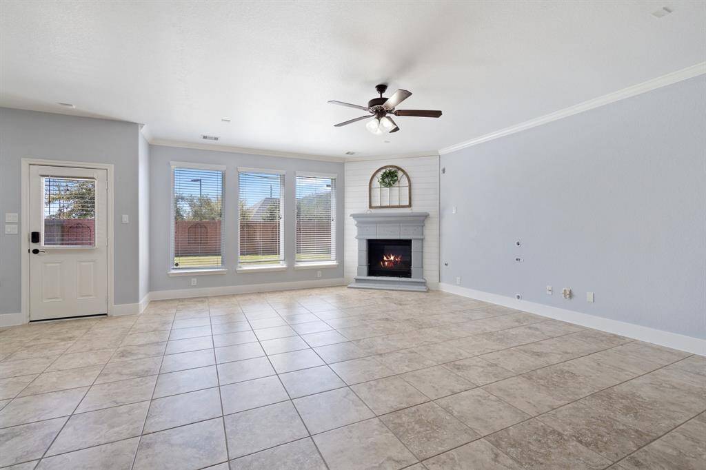 Living area featuring a fireplace & natural light