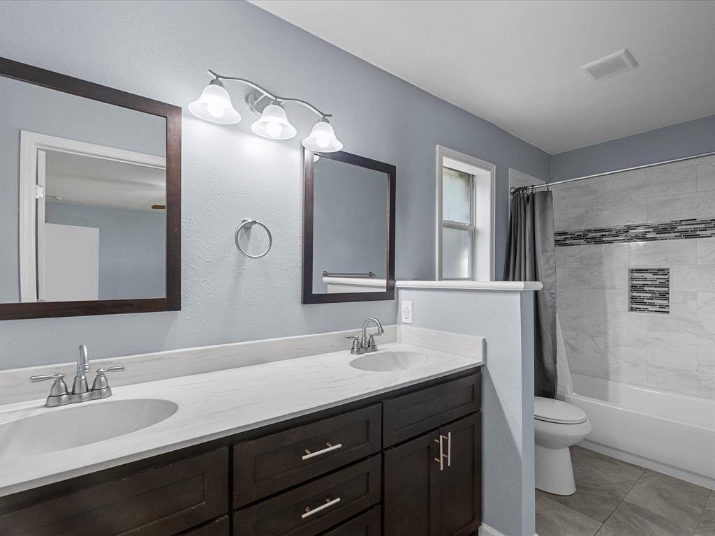 Primary bath with dual sinks and vanities