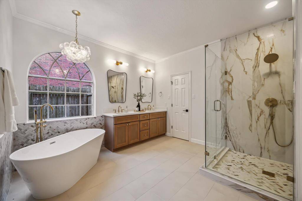 BOAST TO YOUR FRIENDS ABOUT YOUR NEWLY RENOVATED EN-SUITE WITH AN EXPANDED SHOWER, LARGE SOAKING TUB, DUAL SINKS, AND CUSTOM TILE WORK.