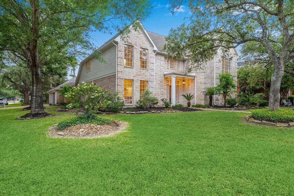 THE HOME SITS ON A LARGE CORNER LOT AND FEATURES A DETACHED 3-CAR GARAGE.