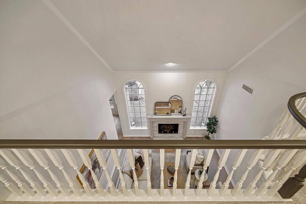 PEEK OVER THE RAILING AT THE FAMILY ROOM.