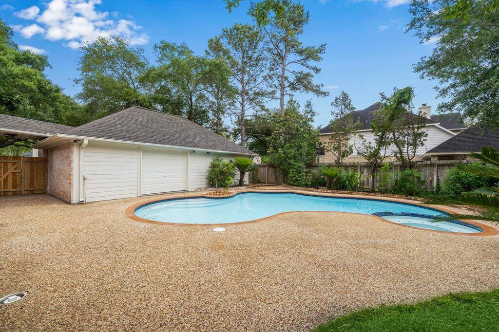 IMAGINE DUAL LOUNGES, A FESTIVE GROUP OF FRIENDS, AND TABLE WITH UMBRELLA.