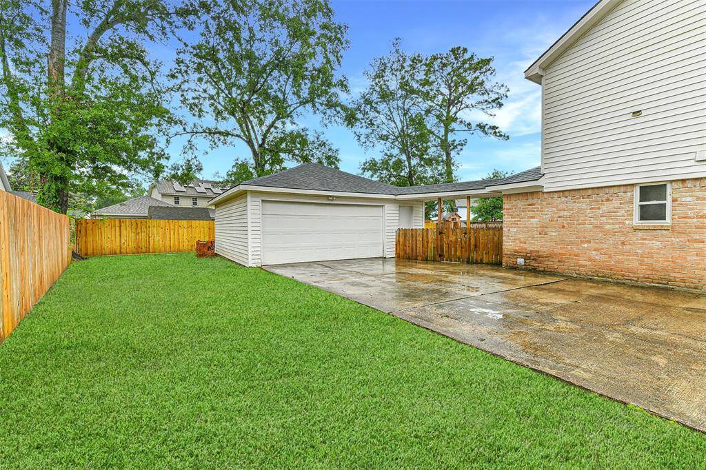 The side yard outside the fenced backyard that you can find next to the detached garage. Perfect space to park your current (or future) boat or camper! It just needs a front gate to comply with HOA rules.