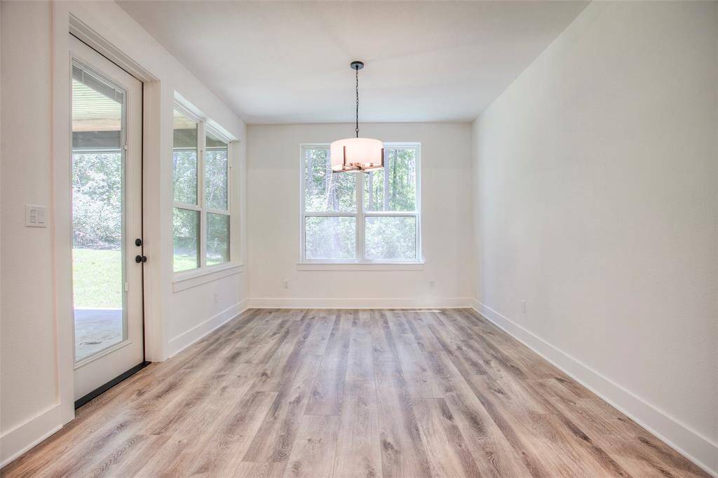 Dining area opening to covered back patio.
