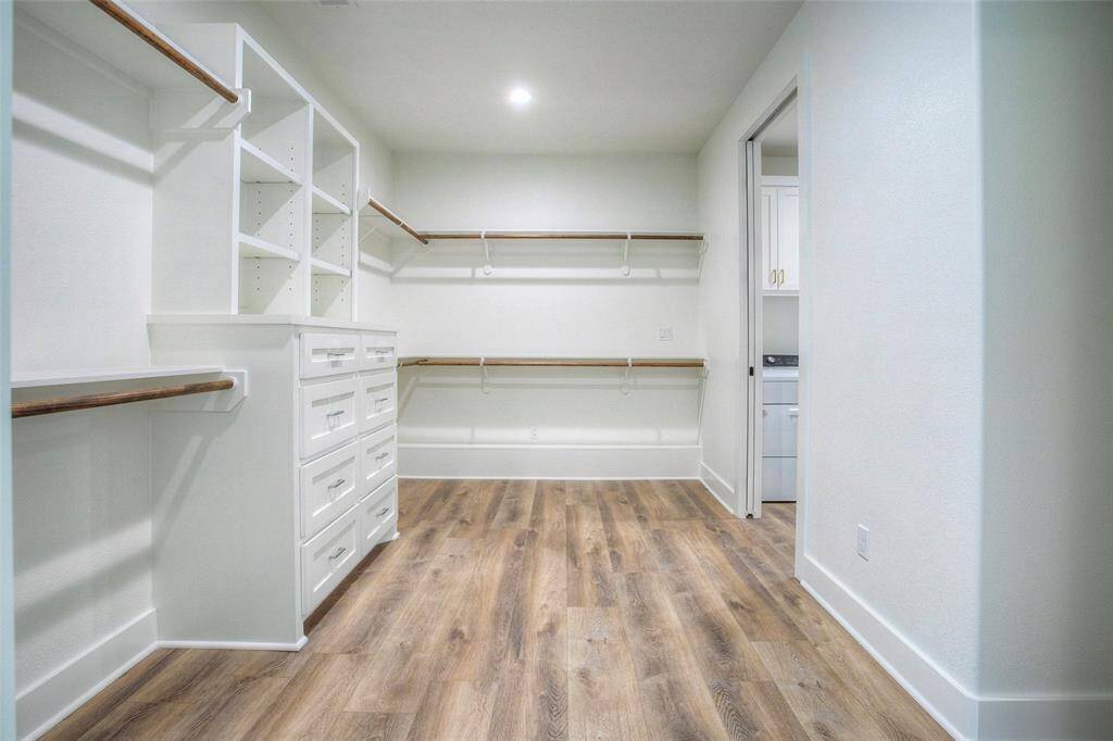 Plenty of room in this large, walk-in closet in the primary bedroom.