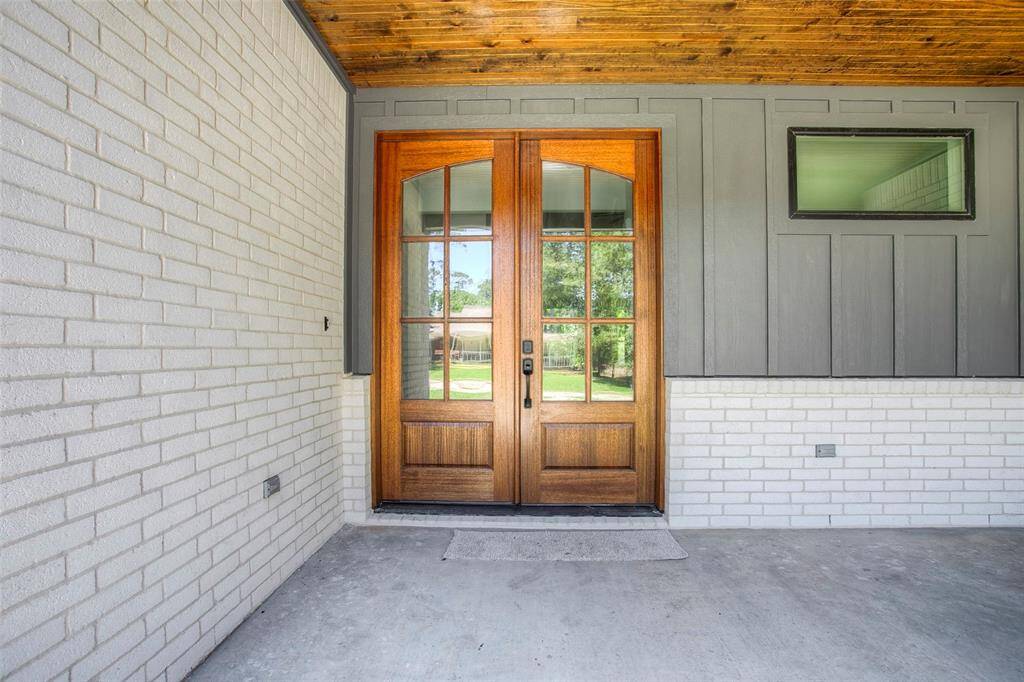Stunning, Mahogany front door with pine ceilings.