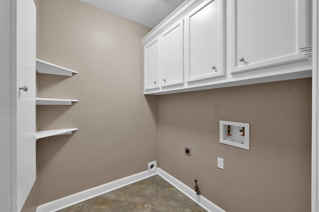 Laundry room off of the Kitchen across from the butlers area