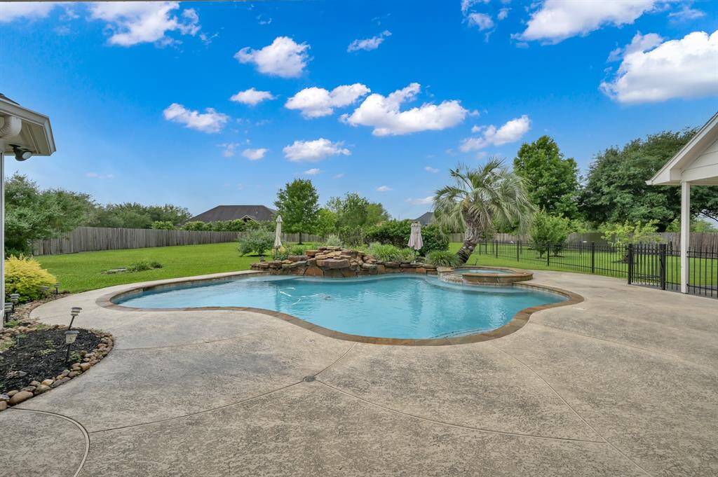 Pool and spa with expansive patio ready for outdoor entertaining all enclosed in the only privacy fence in the neighborhood.
