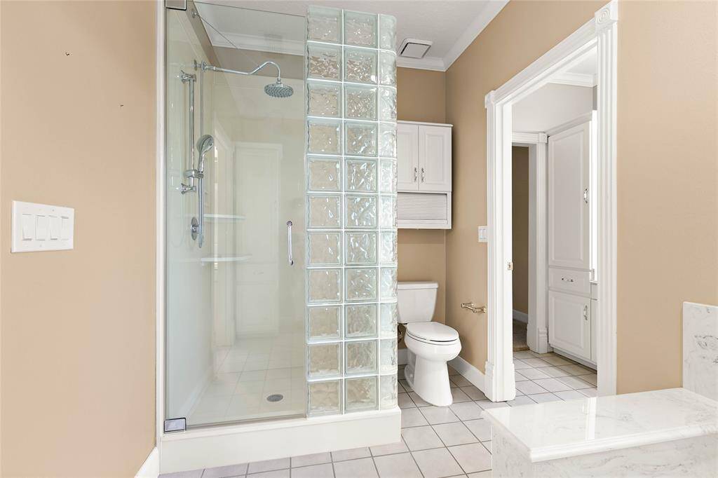 Full bath serving the secondary bedrooms with a tiled tub/shower combo.