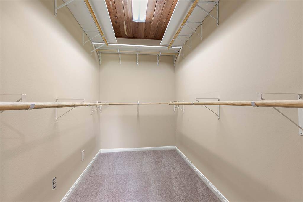 Additional walk-in closet with cedar lining and ample storage space for organizing wardrobes.