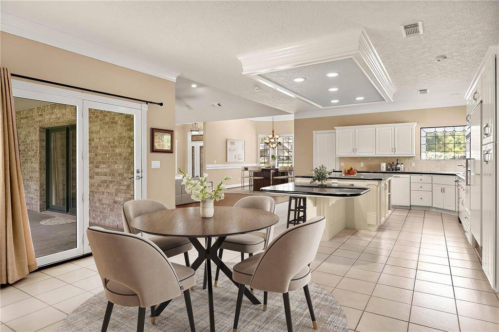 Living spaces including the breakfast, formal dining and family rooms are centered around an open concept kitchen for family closeness and ease of entertaining.