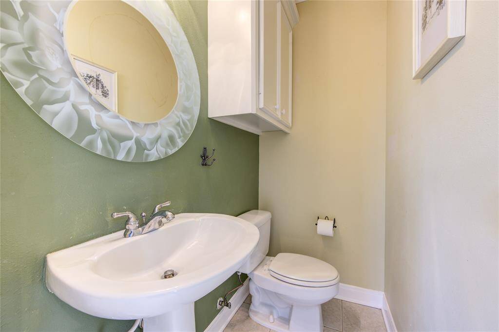 Half bath located near the front of the home-perfect for guests!