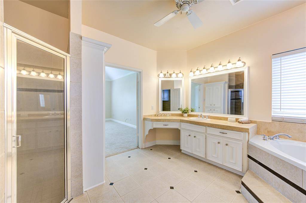 A beautifully designed primary bathroom offering a tranquil space with stylish finishes and ample comfort.