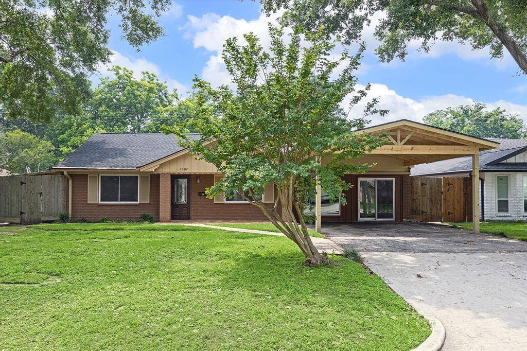 Front of home with brand new carport.
