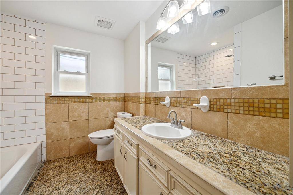 Guest bath with tub/shower.