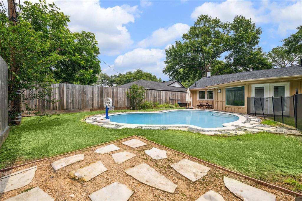 Pool with safety fence.  Large shed not shown.