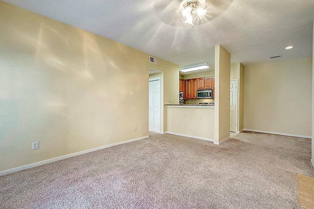 Spacious, Light & Bright  Living Room with New Flooring,  large window and French Door to Patio - AFTER