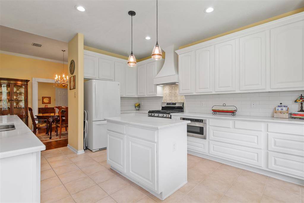 Large updated kitchen with an abundance of storage. Kitchen has cabinets and oversized drawers.