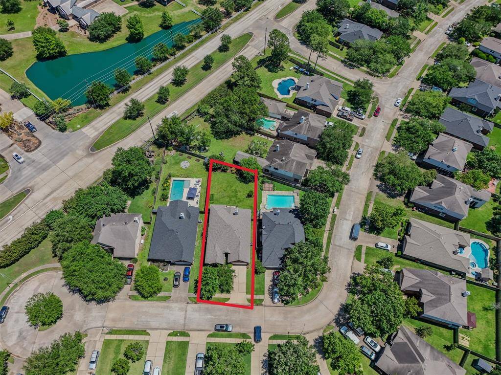 Another aerial view of the home located on a cul-de-sac street.