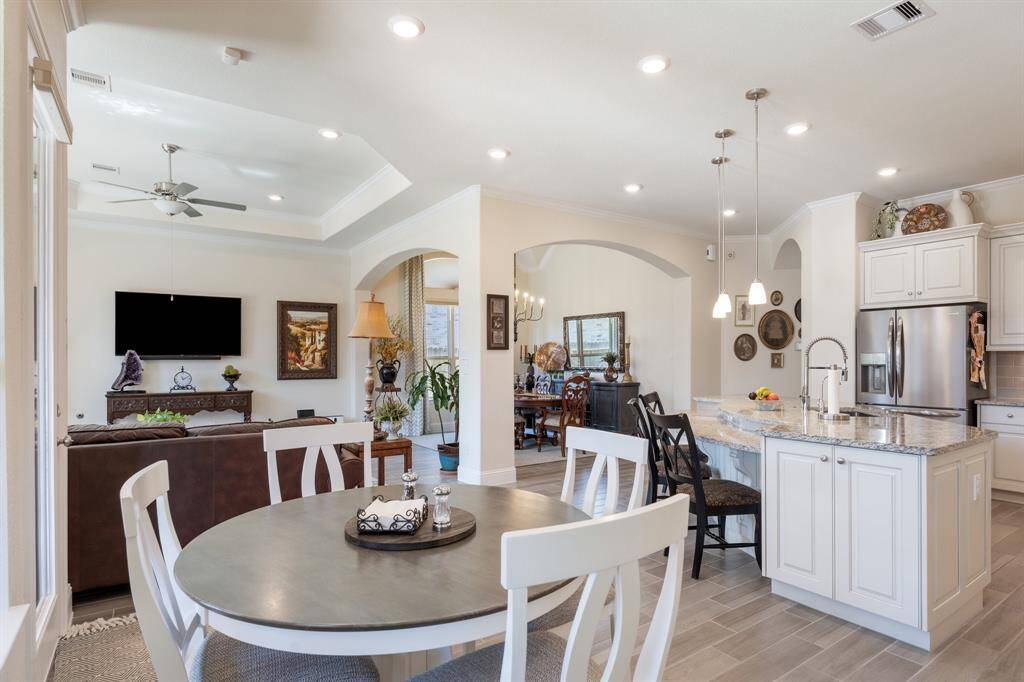 Viewpoint from the breakfast room shows the open concept and flow of the main living spaces.