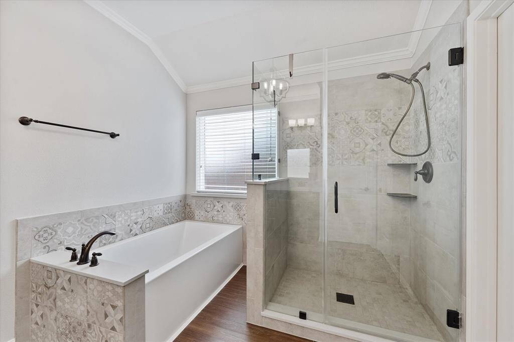 Deep soaking tub and spacious separate shower.
