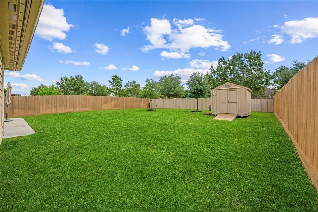Large backyard complete with added storage shed