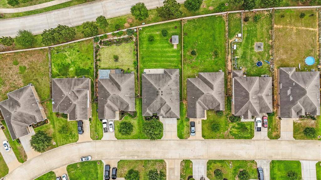 Aerial view of the home nestled on the lot