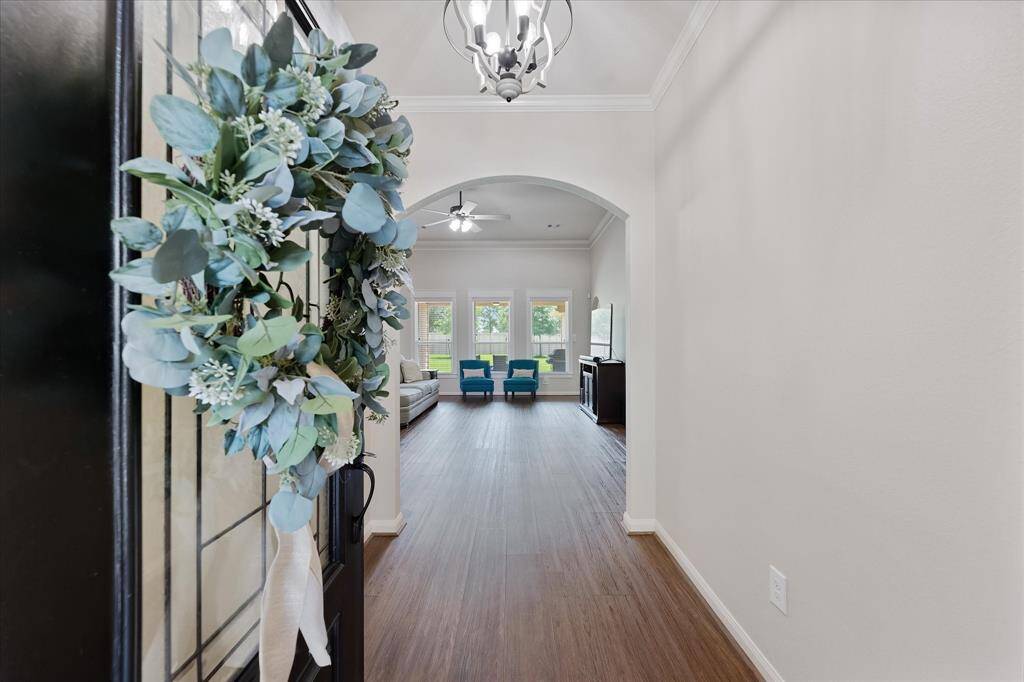 Luxury vinyl flooring flows from the entry to the main living areas