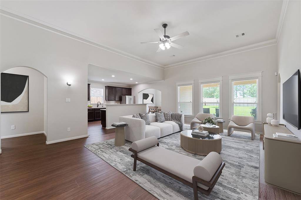 Open living, kitchen and dining rooms with tons of natural light. Virtually staged