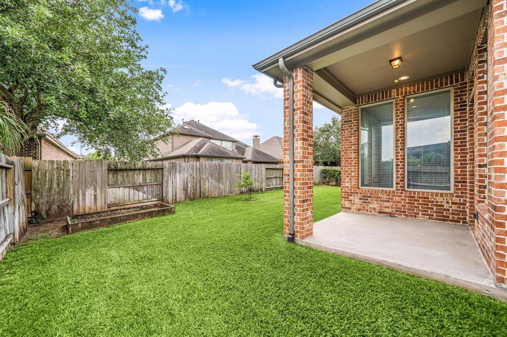 Raised Garden Bed is located in the backyard and ready for your Summer Vegetables!