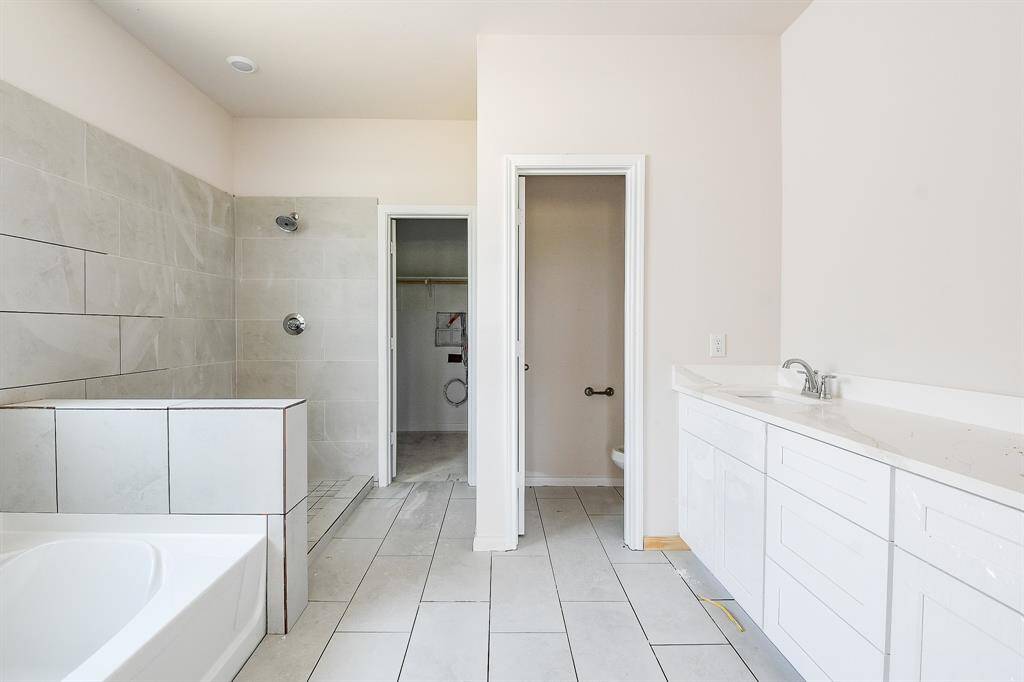 Look at the gorgeous tile flooring and also on the shower wall.