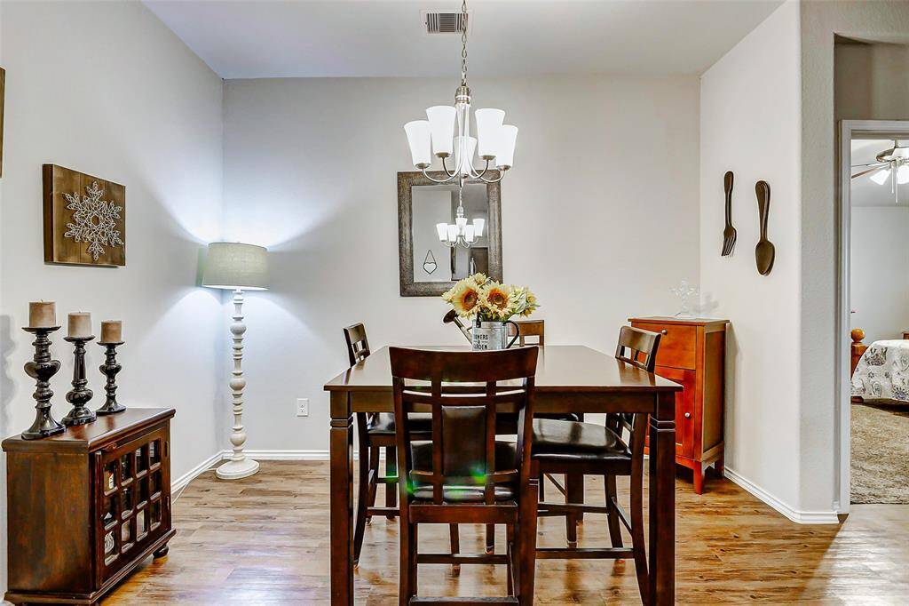 The dining area is both spacious and inviting, easily accommodating a large table—perfect for gathering family and friends for meals, celebrations, or special occasions.