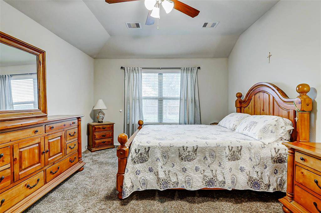 A large window invites soft natural light to gently fill the room, creating a peaceful, sunlit environment perfect for starting and ending your day.