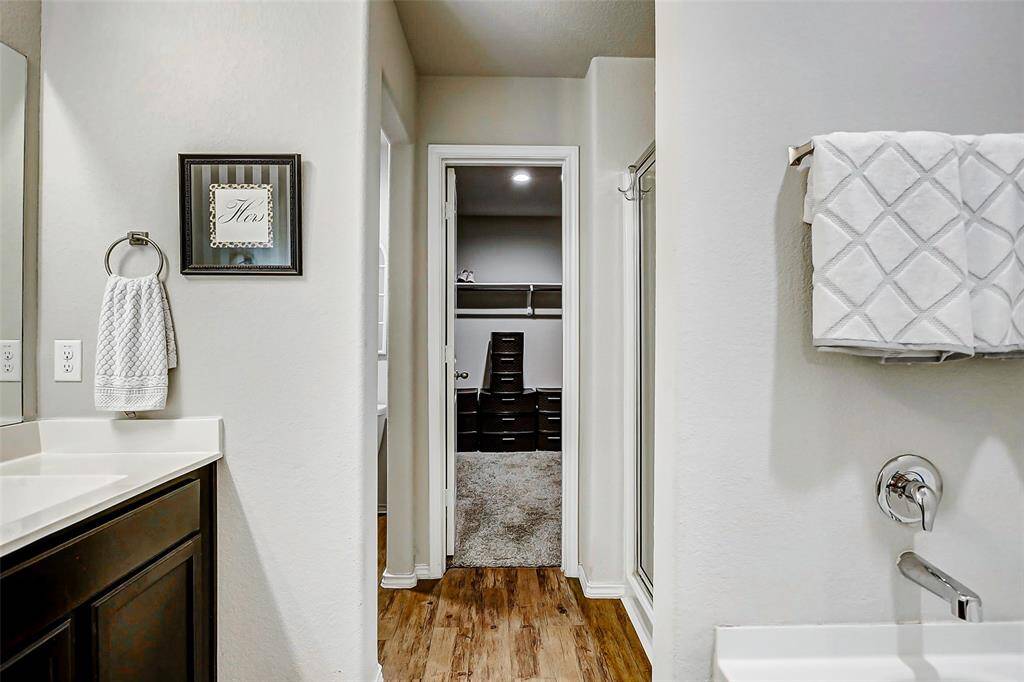 The space is finished with tasteful fixtures and a clean, neutral palette that promotes relaxation.
