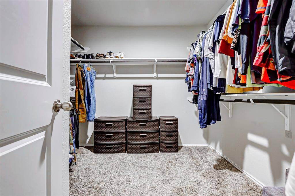 Completing the suite is a generously sized walk-in closet, offering abundant storage and organization for clothing, shoes, and accessories—all within easy reach.