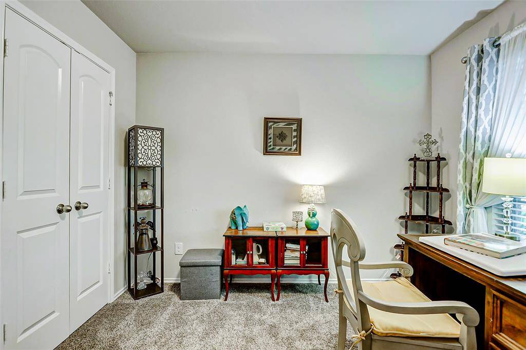 This bedroom offers a spacious double-door closet with ample storage space, making the room both functional and inviting.