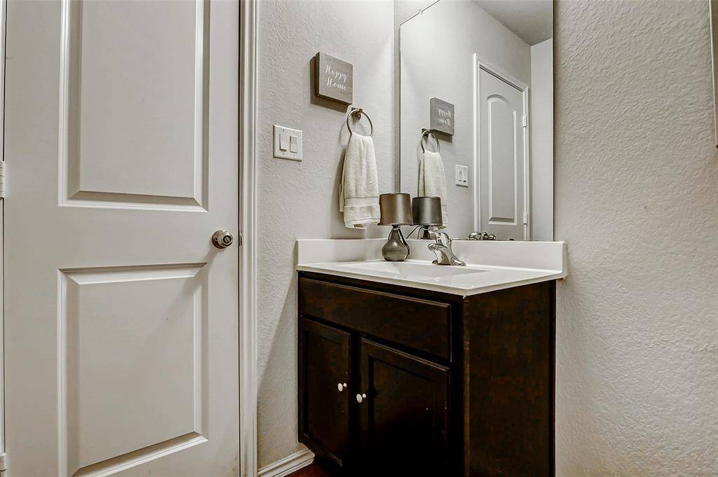 A second full bathroom conveniently serves these rooms with modern fixtures and finishes.