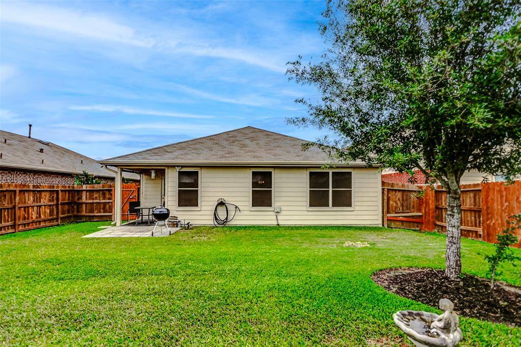 Fully fenced, this outdoor haven provides peace of mind for both children and pets while creating a secluded retreat for everyday enjoyment.