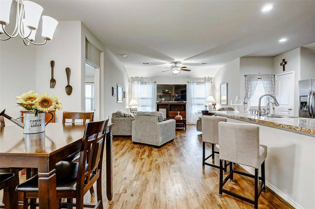 The open-concept floorplan offers a seamless flow between the dining room, family room, and kitchen, creating a spacious and connected environment ideal for both everyday living and entertaining guests.