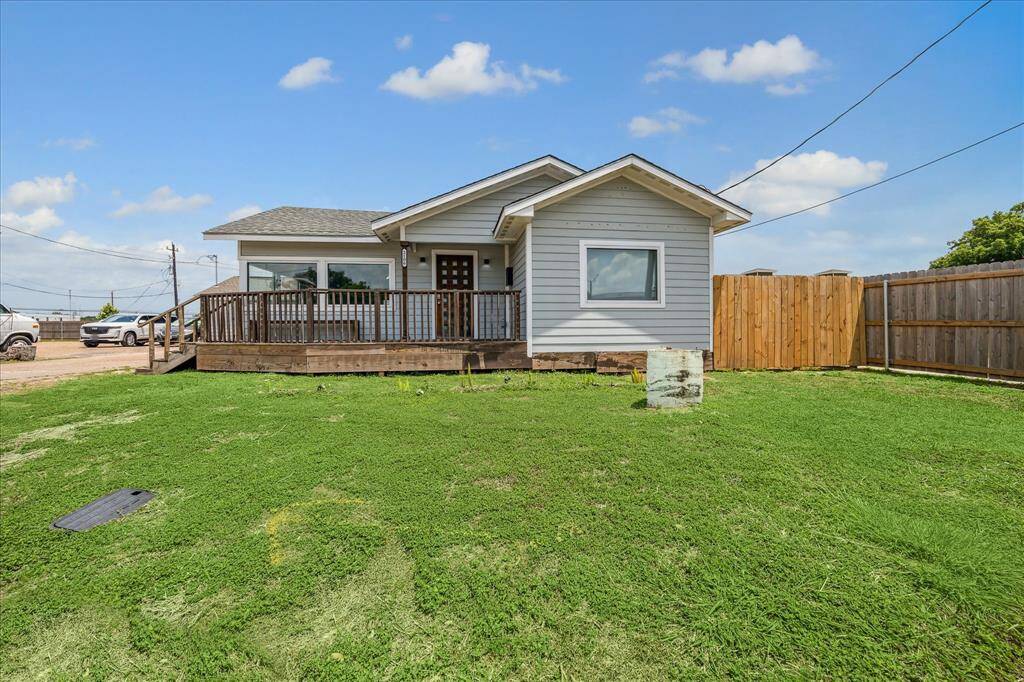 Front exterior with a generously sized lawn.