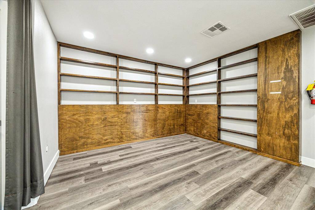Built-in wall shelves with soft recessed lighting.