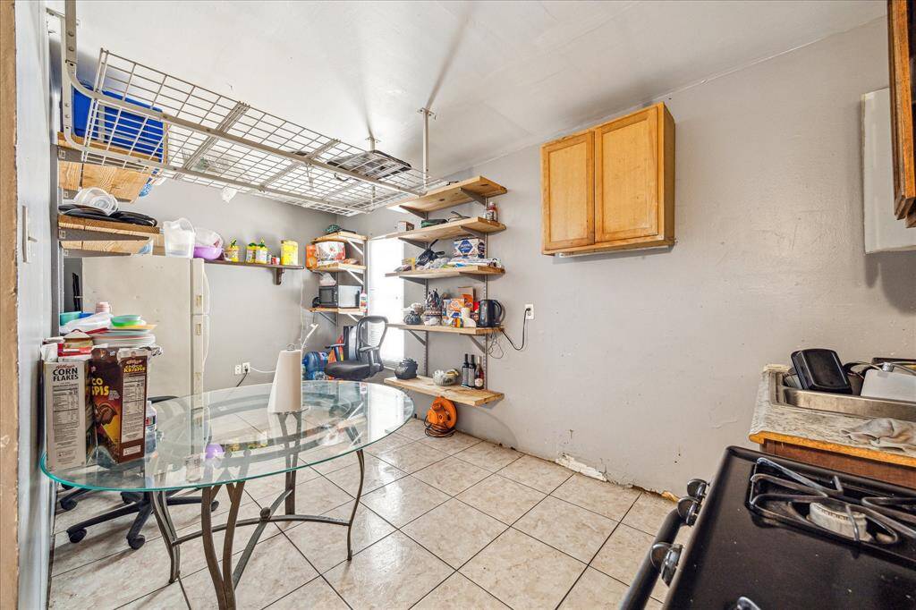 Clean and practical kitchen with essential appliances.